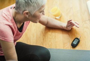 woman-checking-blood-sugar-levels woman-checking-blood-sugar-levels